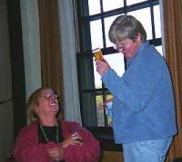 Madison Alder Judy Olson inspects Elvy's legal medicinal pot.