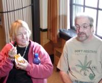 Elvy Musikka displays her prescription bottle and federally-supplied legal medical marijuana, as fellow glaucoma patient Gary Storck looks on.