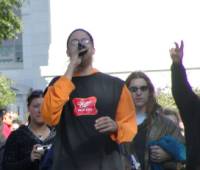 Rocker T., who led the parade up State St. addresses the crowd.